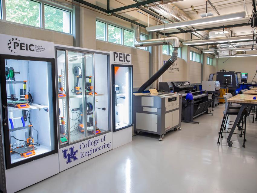 Room with 3D printers in a display case